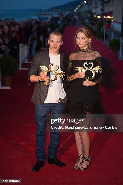 Kevin Azais poses with Josephine Japy during the closing Ceremony of the 29th Cabourg Romantic Film Festival on June 13, 2015 in Cabourg, France.