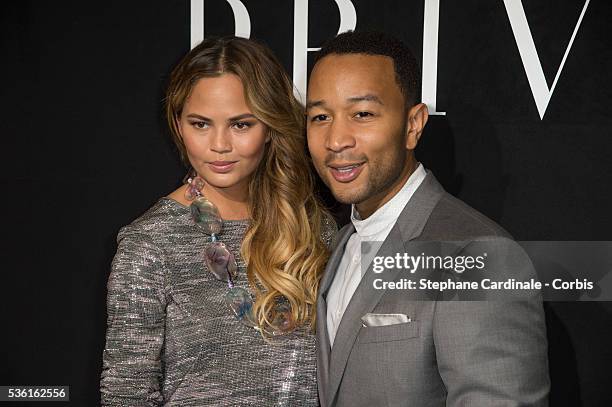 Singer John Legend and his wife Model Chrissy Teigen attend the Giorgio Armani Prive show as part of Paris Fashion Week Haute-Couture Fall/Winter...