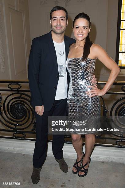 Mohammed Al Turki and actress Michelle Rodriguez attend the Jean Paul Gaultier show as part of Paris Fashion Week Haute Couture Fall/Winter 2015/2016...