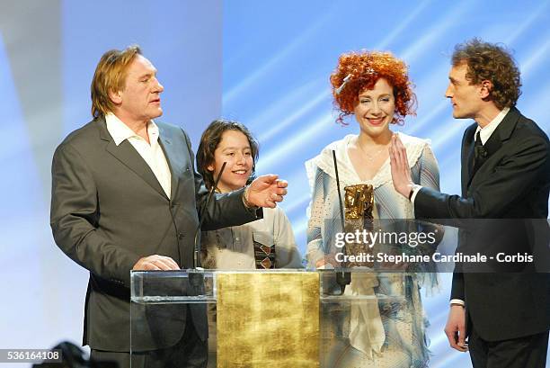 Julie Depardieu receives a surprise visit on stage by father Gerard Depardieu and Antoine Pialat as she receives one of two awards for Best...