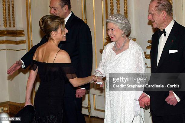 Queen Elizabeth II and Duke of Edinburgh accompanied by French President Jacques Chirac and first Lady Bernadette greet journalist Claire Chazal for...