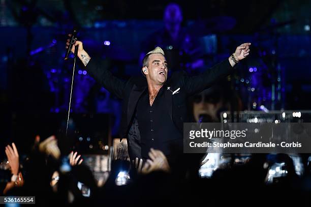 Robbie Williams performs onstage during the Second Day of the 10th Anniversary on the Throne Celebrations on July 12, 2015 in Monaco, Monaco.