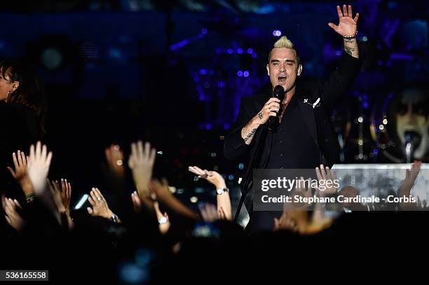 Robbie Williams performs onstage during the Second Day of the 10th Anniversary on the Throne Celebrations on July 12, 2015 in Monaco, Monaco.