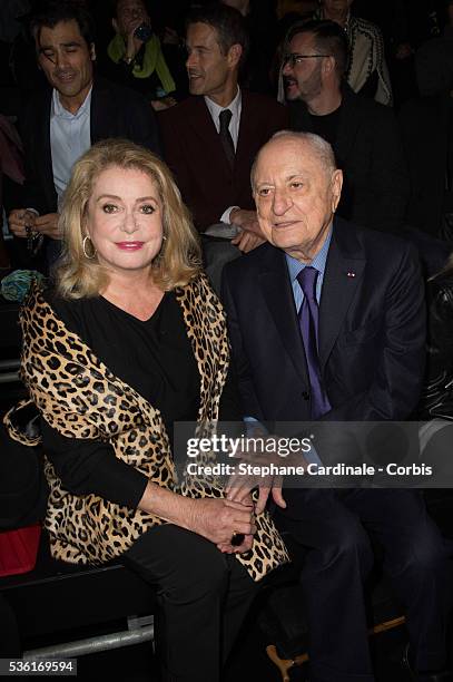 Catherine Deneuve and Pierre Berge attend the Saint Laurent show as part of the Paris Fashion Week Womenswear Spring/Summer 2016 on October 5, 2015...