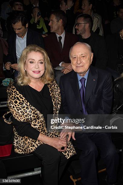 Catherine Deneuve and Pierre Berge attend the Saint Laurent show as part of the Paris Fashion Week Womenswear Spring/Summer 2016 on October 5, 2015...
