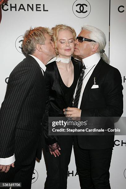 Actors Baz Luhrman and Nicole Kidman with fashion designer Karl Lagerfeld at the Chanel Spring-Summer 2005 ready-to-wear fashion collection, during...