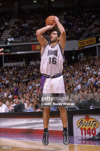 Guard Pedrag Stojakovic of the Sacramento Kings shoots an outside jump shot during the pre-season game against the Memphis Grizzlies at Arco Arena in...