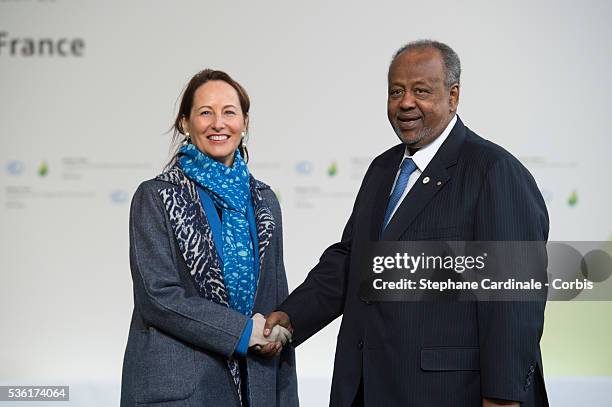 French Minister of Ecology, Sustainable Development and Energy Segolene Royal shakes hands with Djibouti President Ismail Guelleh upon his arrival...