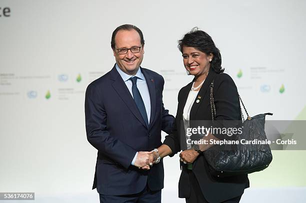 French President Francois Hollande greets Mauritius President Ameenah Gurib-Fakim as she arrives for the COP21 United Nations Climate Change...