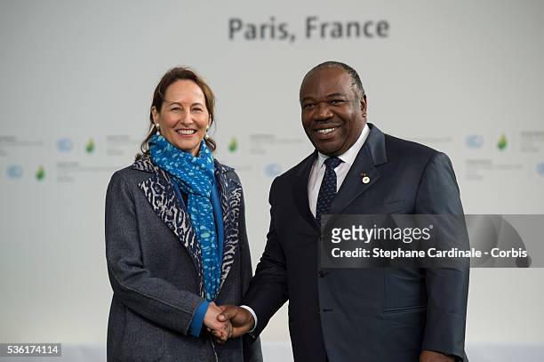 French Minister for Ecology, Sustainable Development and Energy Segolene Royale , greets Gabonese President Ali Bongo Ondimba upon his arrival for...