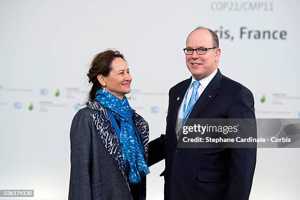 French Minister for Ecology, Sustainable Development and Energy Segolene Royal greets Prince Albert II of Monaco as he arrives for the COP21 United...