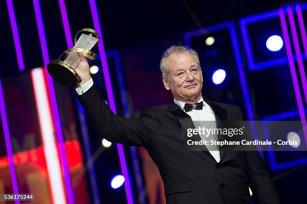 Bill Murray poses with his Tribute Award during the Opening Ceremony of the 15th Marrakech International Film Festival, on December 4 in Marrakech,...