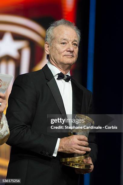 Bill Murray poses with his Tribute Award during the Opening Ceremony of the 15th Marrakech International Film Festival, on December 4 in Marrakech,...