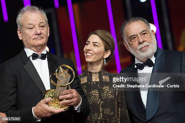 Bill Murray poses with his Tribute Award, with Sofia Coppola and Francis Ford Coppola during the Opening Ceremony of the 15th Marrakech International...