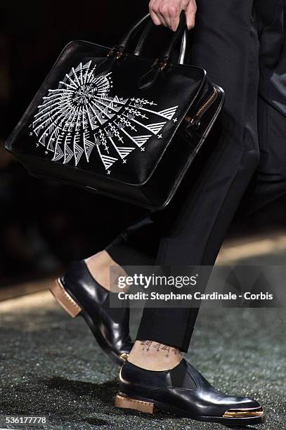 Bag of a model is seen as he walks the runway during the Berluti Menswear Fall/Winter 2016-2017 show as part of Paris Fashion Week on January 22,...