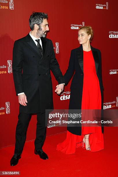 Emmanuelle Beart and partner Frederic arrive at the Cesar Film Awards 2016 at Theatre du Chatelet on February 26, 2016 in Paris, France.