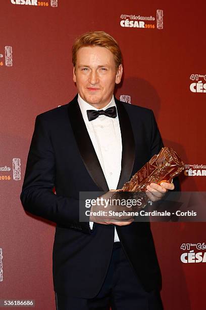 Actor Benoit Magimel poses with his award of Best actor in a supporting role for the movie 'La Tete Haute' during The Cesar Film Awards 2016 at...