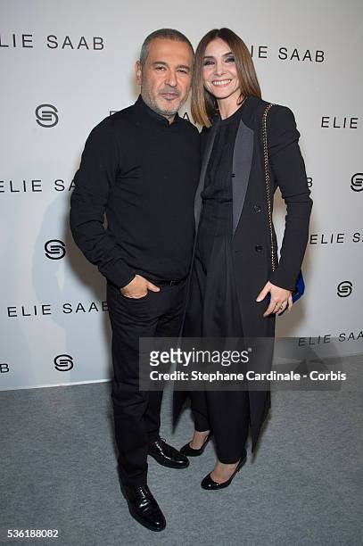 Designer Elie Saab and Clotilde Courau pose backstage after the Elie Saab show as part of the Paris Fashion Week Womenswear Fall/Winter 2016/2017 on...