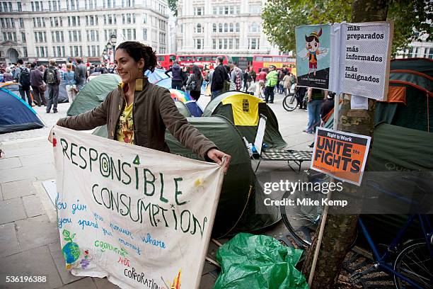 Spanish protester with her sign asking fro responsible consumption. Occupy London protest at St Pauls, October 16th 2011. Protest spreads from the US...
