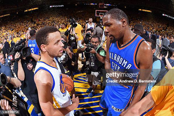 Stephen Curry of the Golden State Warriors talks to Kevin Durant of the Oklahoma City Thunder after Game Seven of the Western Conference Finals...