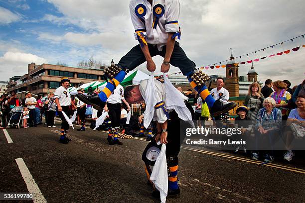 The Hammersmith Morris Men entertaining the crowds with English morris dancing on Southwark Bridge which is transformed into a giant banqueting...