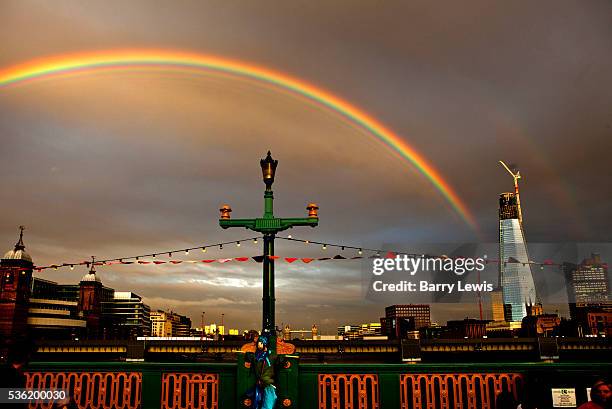 Rainbow breaks out over Southwark Bridge which is transformed into a giant banqueting space, designed by Cathy Wren, with visitors invited to share a...