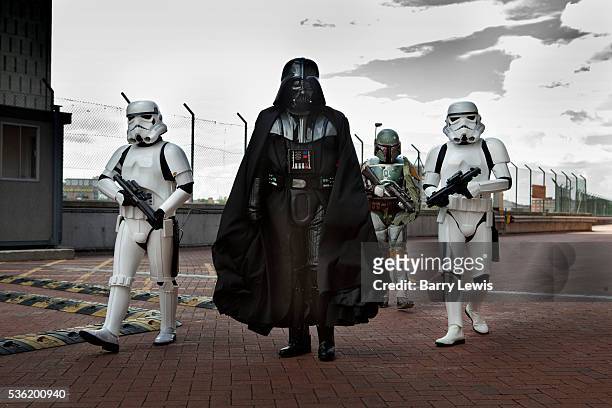 Star Warriors group as storm troopers led by Darth Vader from Starwars, attending the London Film and Comic Con LFCC is a convention held annually in...