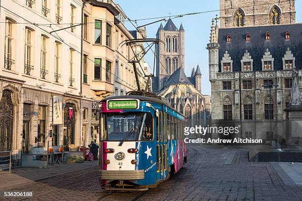 De Lijn tram travels along route 4 to Zwinjaardebrug in central Ghent, Belgium.