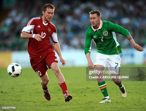 Republic of Ireland's Aiden McGeady vies with Belarus's midfielder Aliaksandr Hleb during the international friendly football match between Republic...