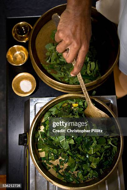 The cooking preparation of the ingredients used for a poultice, which then is gently applied onto the body with medicated oils. This is part of...