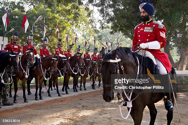 Soldiers of the Presidential Bodyguard regiment prepare the final touches before they head out of their barracks to the Rashtrapati Bhavan . The...