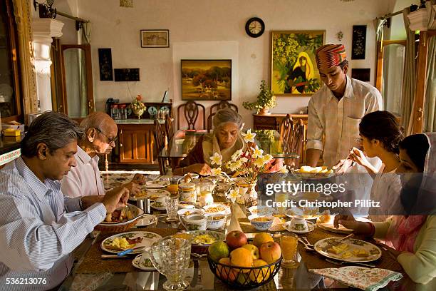 Nobleman Nahar Singhji, also known as Rao Saheb , with his wife Rani Saheb , son, daughter-in-law and grandaughter, enjoy a relaxed breakfast in...