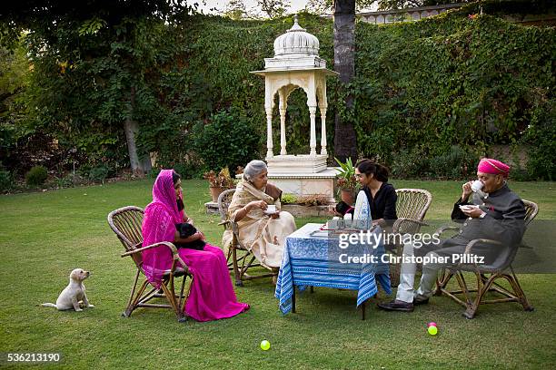 Nobleman Nahar Singhji, also known as Rao Saheb, with his wife Rani Saheb, daughter-in-law and grandaughter, enjoy a genteel and relaxed cup of tea...