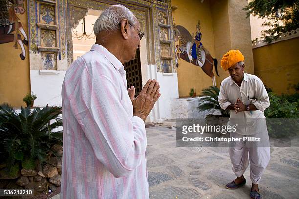 Rawat Nahar Singhji, also known as Rao Saheb, greets the staff of the Deogarh Mahal, a fort - palace, now converted into a heritage hotel after the...