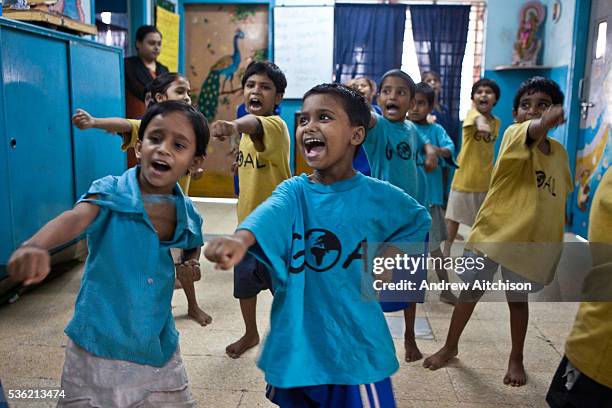 Karate class at a CINI halfway house in Calcutta, India. Child In Need Institute run halfway houses for vulnerable street children from as young as 5...