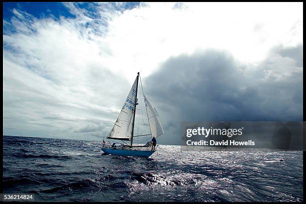 "British sailor Ian Clover waves to his wife and journalists as he arrives in Antigua. After a trans atlantic crossing. His 15 year old son Seb...