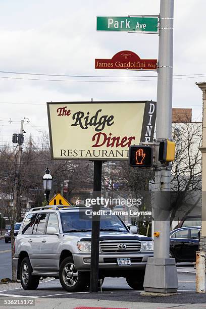 ©James Leynse, 12/7/2013, Park Ridge, New Jersey -- The Ridge Diner and a sign for the newly renamed James Gandolfini Way in honor of the actor who...