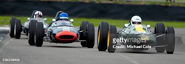 Lotus-Climax 25 driven by Nick Fennell, , followed by a 1962 Lotus-BRM 24 driven by Alan Baillie in the Glover Trophy Race