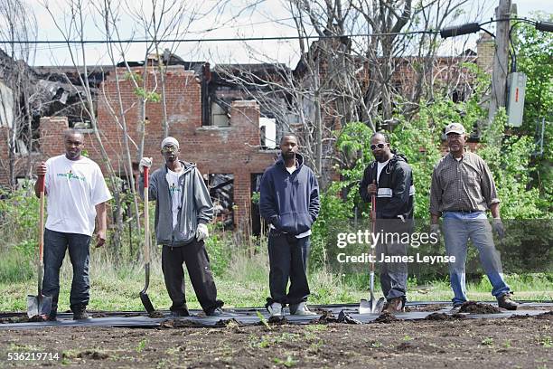 Members of the nonprofit Detroit organization Urban Farming working on a vegetable garden in an area of Detroit that was the epicenter of the 1967...