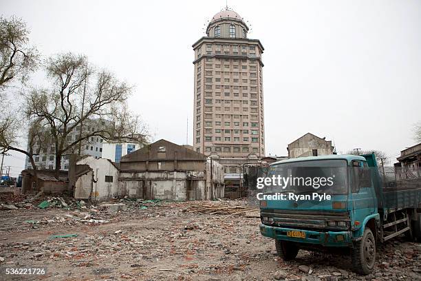 Truck is parked in a demolition zone that once contained old lane houses, along the south Bund, or riverfront area. Shanghai is planning on spending...