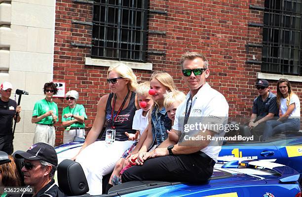 May 28: Race car driver Ed Carpenter and his family makes their way South on Pennsylvania Street during the Indianapolis 500 Festival Parade in...