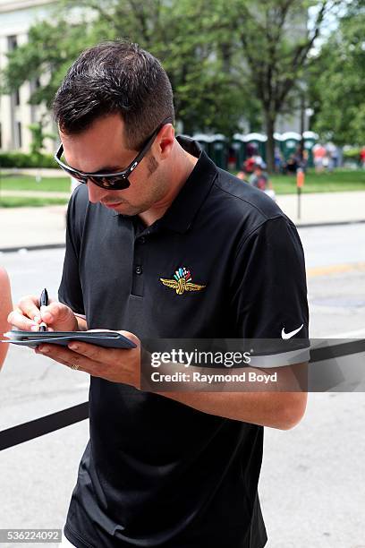 May 28: Race car driver Sam Hornish, Jr. Greets fans outside the Indianapolis Central Library during the Indianapolis 500 Festival Parade in downtown...