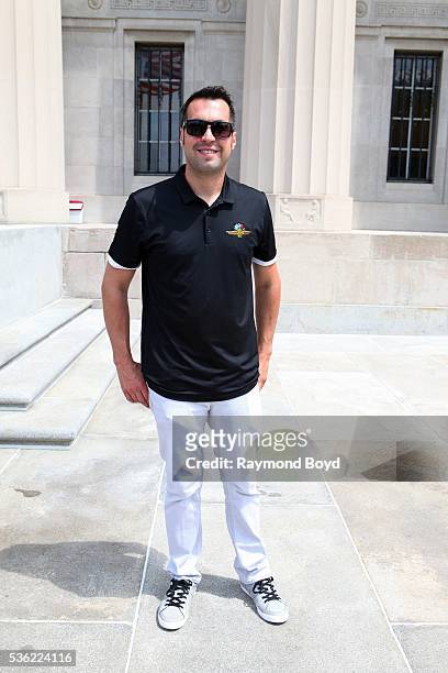 May 28: Race car driver Sam Hornish, Jr. Poses for photos outside the Indianapolis Central Library during the Indianapolis 500 Festival Parade in...