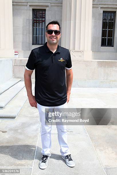 May 28: Race car driver Sam Hornish, Jr. Poses for photos outside the Indianapolis Central Library during the Indianapolis 500 Festival Parade in...