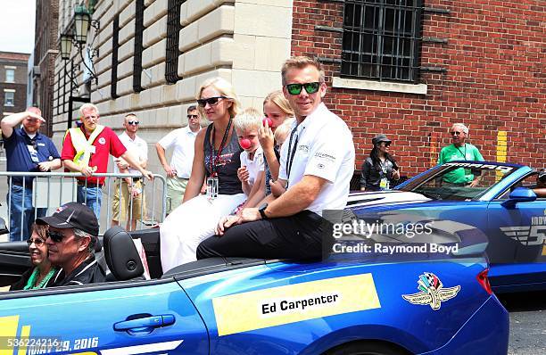 May 28: Race car driver Ed Carpenter and his family makes their way South on Pennsylvania Street during the Indianapolis 500 Festival Parade in...