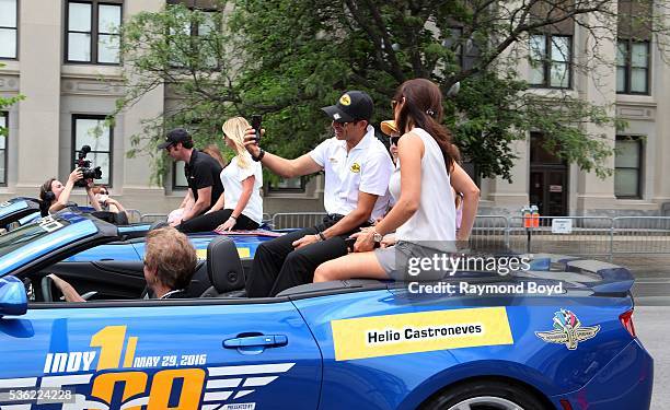 May 28: Race car driver Helio Castroneves and his family makes their way South on Pennsylvania Street during the Indianapolis 500 Festival Parade in...