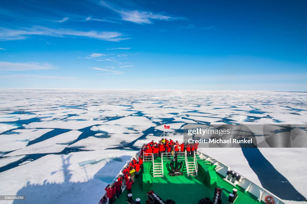 Expedition boat navigating through the pack ice in the Arctic shelf, Svalbard, Arctic