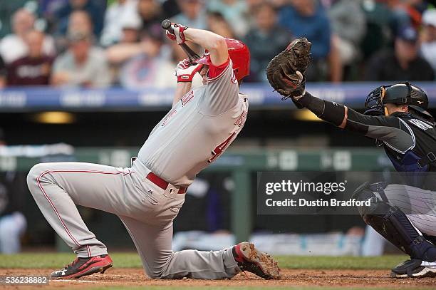 Jon Moscot of the Cincinnati Reds was hit by a pitch in the third inning of a game against the Colorado Rockies at Coors Field on May 31, 2016 in...