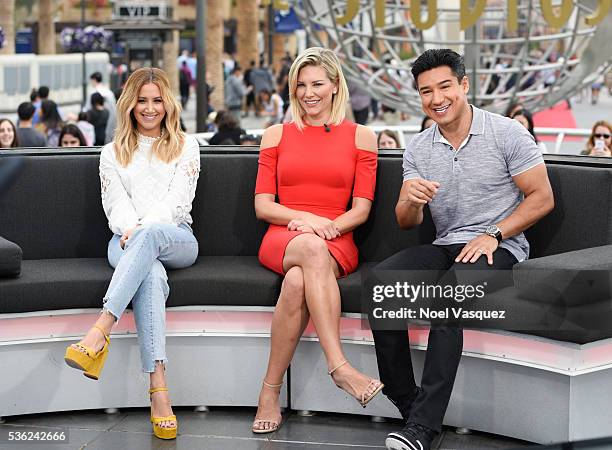 Ashley Tisdale, Charissa Thompson and Mario Lopez visit "Extra" at Universal Studios Hollywood on May 31, 2016 in Universal City, California.