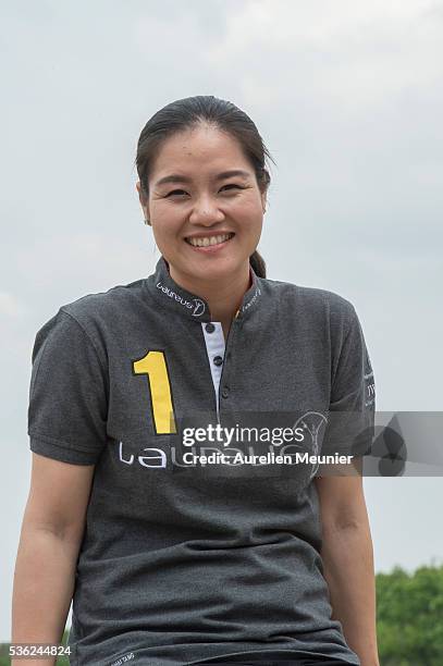 Former Tennis player and new Laureus Academy Member Li Na poses during the Li Na Laureus Academy Member Announcement at the Eiffel Tower on May 27,...